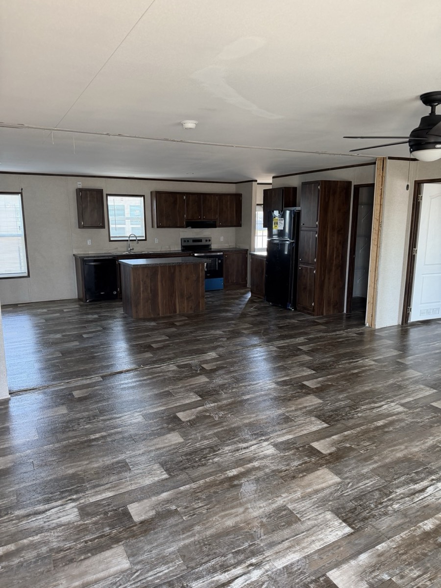 2023 Champion 30×60 — Open living area and island kitchen