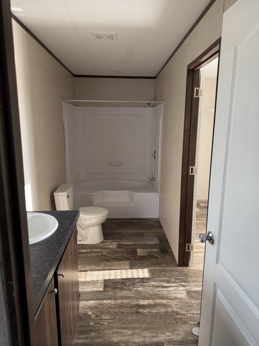 2023 Champion 30×60 — Bathroom with tub and shower
