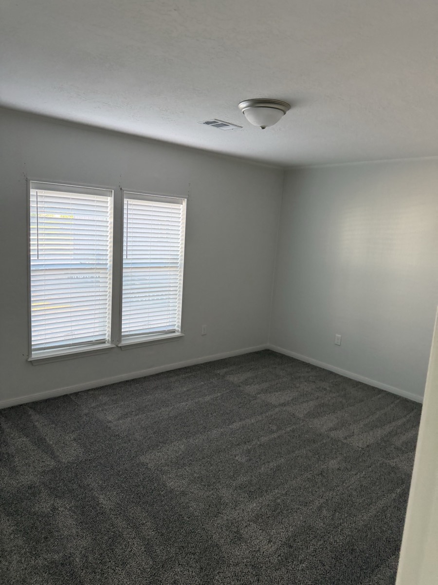 2023 Deming Solitaire 32×82 — Bedroom with paired windows