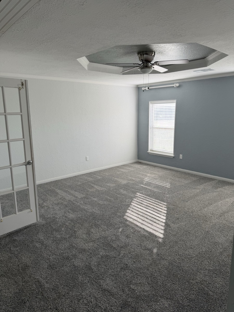 2023 Deming Solitaire 32×82 — Primary bedroom with tray ceiling