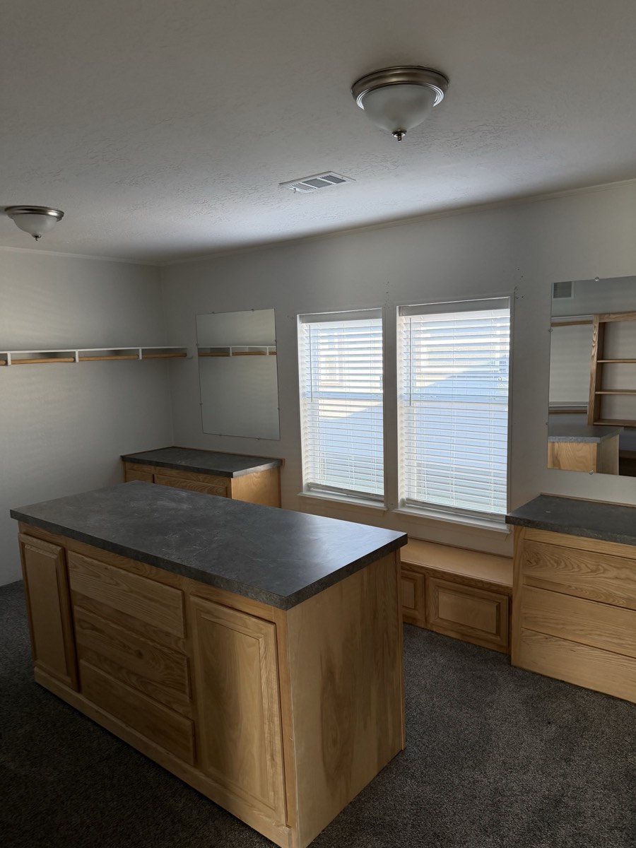 2023 Deming Solitaire 32×82 — Dressing room with storage island