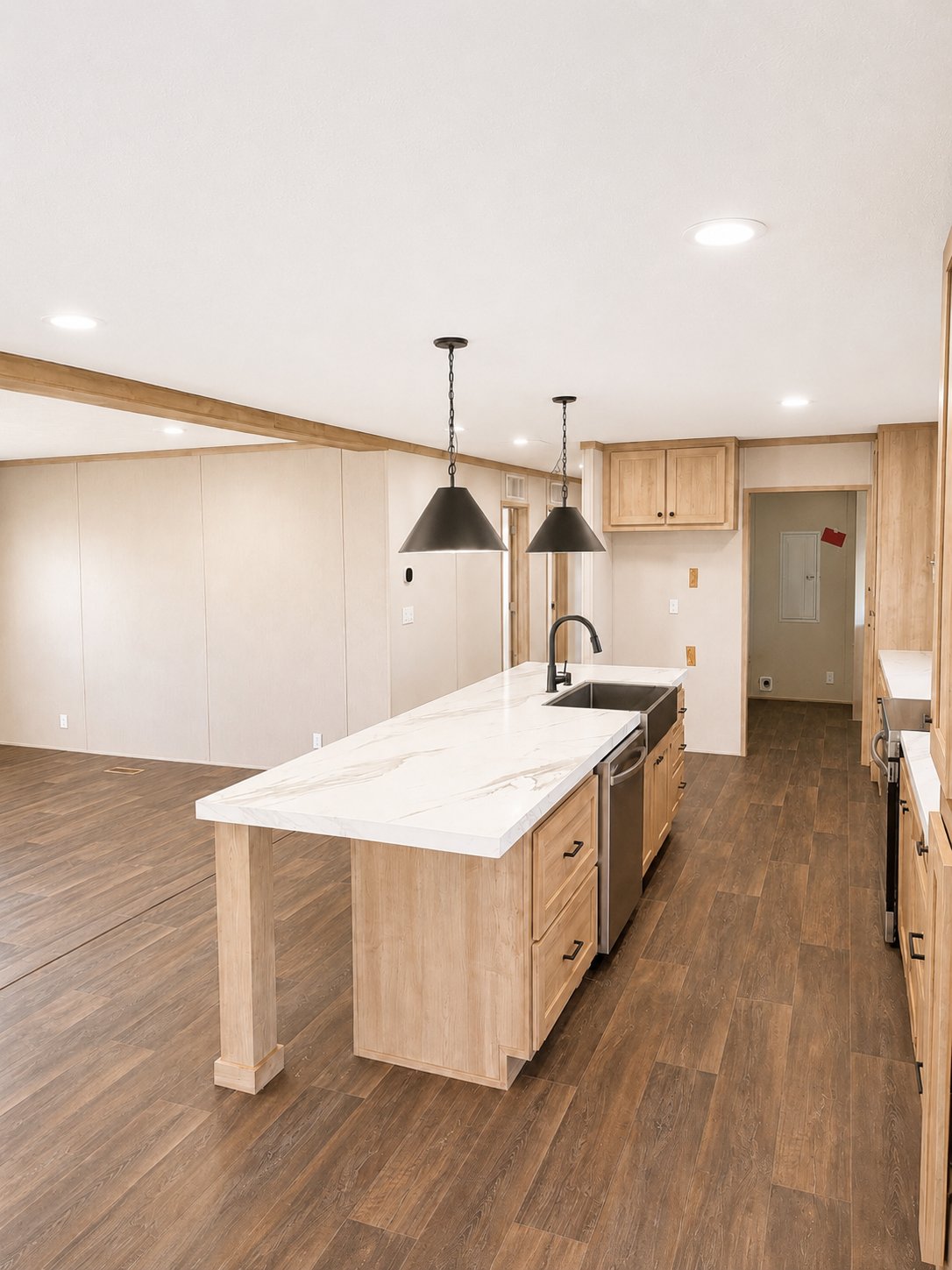 Kitchen with quartz island and wood ceiling beams