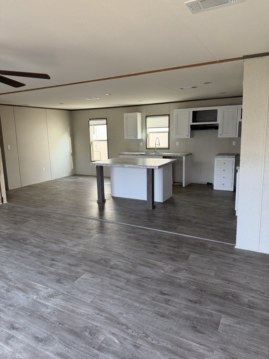 2025 Jessup Panama 28×56 — Open living area and island kitchen