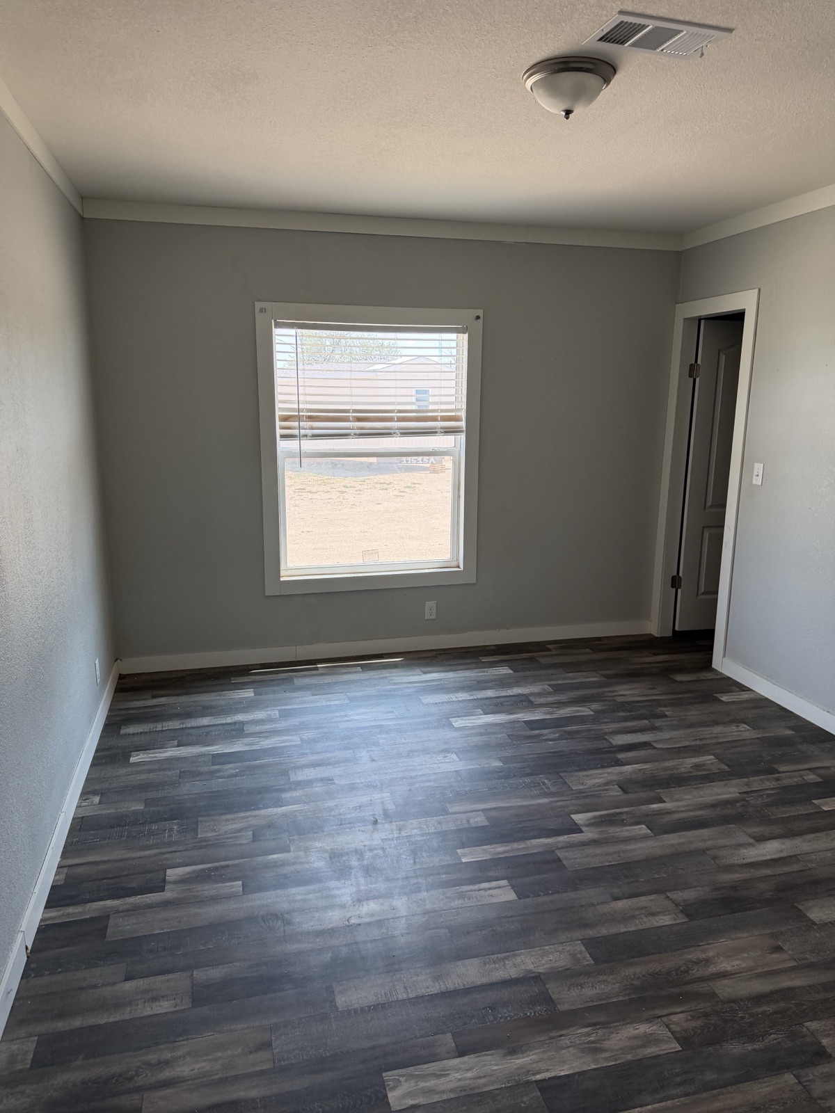 2025 Palm Harbor Keystone 30x76 carpeted bedroom